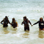 Steve on far right guides his students through the surf zone